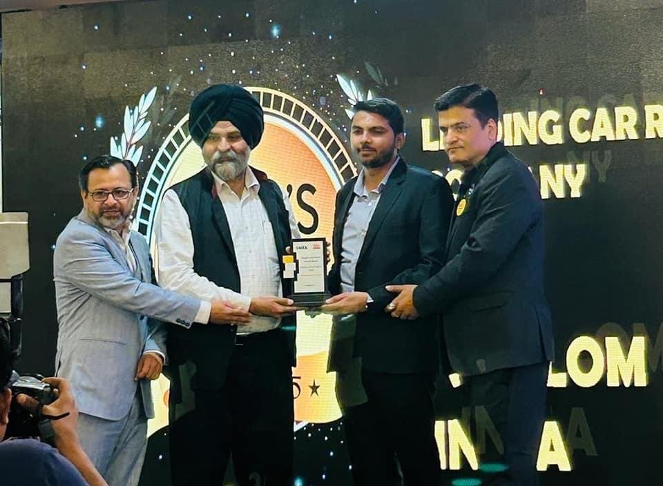 Nikhil Gill receiving the Leading Car Rental Company of the Year award