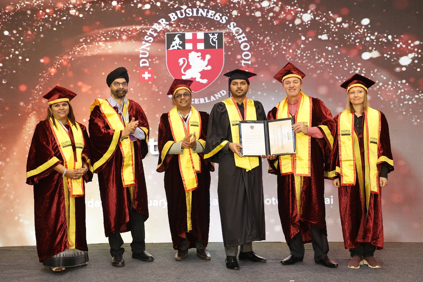 Nikhil Gill receiving an Honorary Doctorate from Dunster Business School, Switzerland